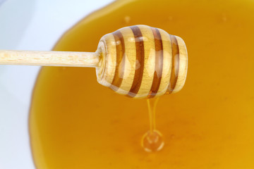 Honey and honey dipper