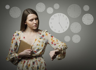 Young woman and wristwatch. 5 p.m.