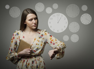 Young woman and wristwatch. 1 p.m.