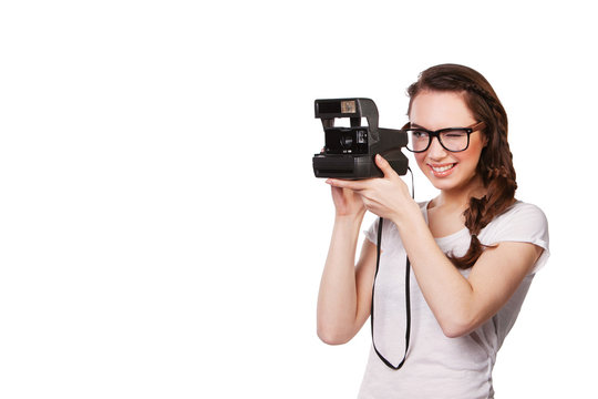 modern young woman in glasses and a Polaroid