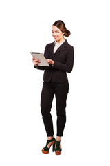 Business woman smiling full length with a tablet