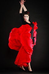 Dance. Spanish girl in red skirt dancing flamenco