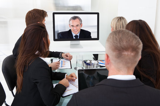 Businesspeople Attending Video Conference