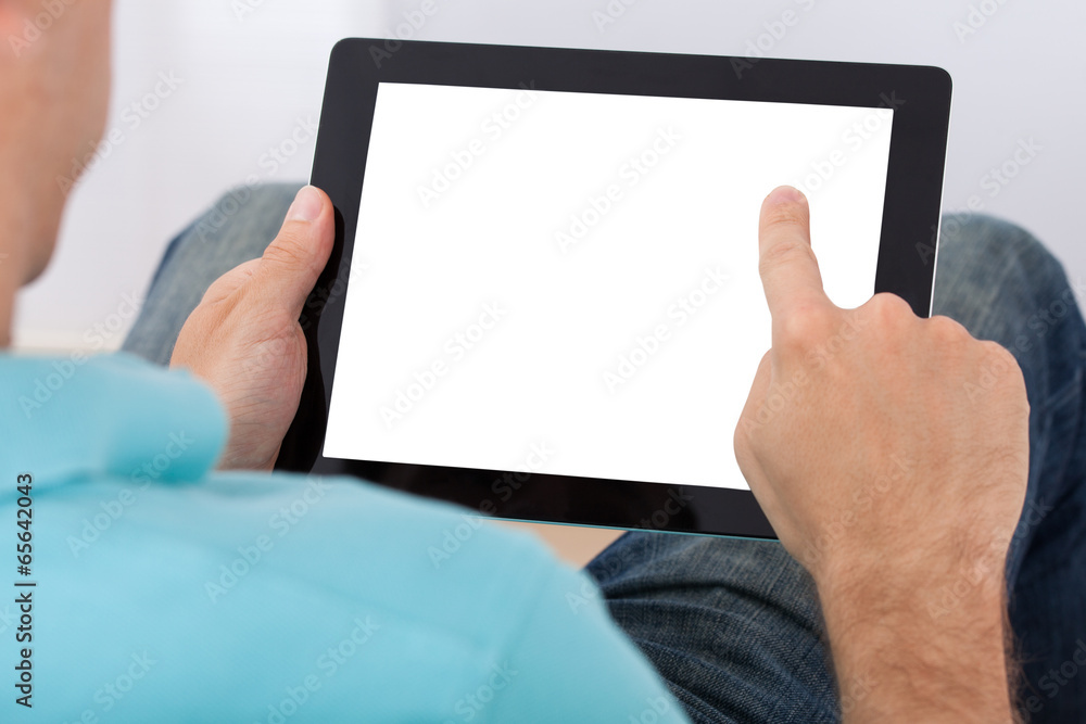 Poster man looking at blank screen of digital tablet