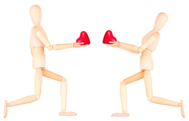 wooden Dummy holding red heart