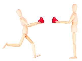 wooden Dummy holding red heart
