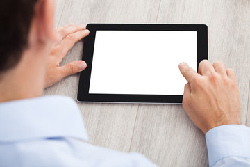 Businessman Using Digital Tablet At Desk