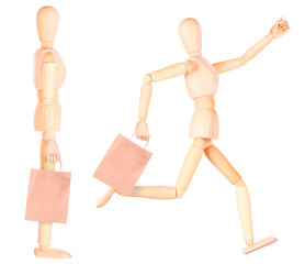 happy wooden Dummy with shopping bags
