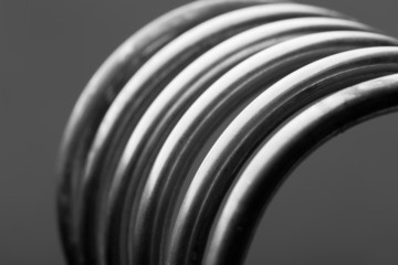 Obraz premium Aluminum spiral isolated on gray background