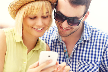 Young couple using a cellphone