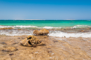 Beautiful azure red sea with waves and rocks in Egypt