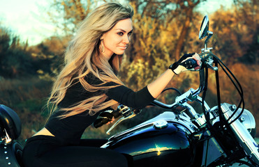 Fototapeta na wymiar Stylized photo of young beautiful woman and bike