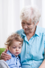 Grandma and sad little boy