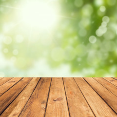 Naklejka na ściany i meble Vintage wooden planks over bokeh green background