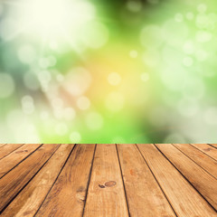 Naklejka na ściany i meble Vintage wooden planks over bokeh green background