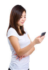 Asian woman looking at mobile phone