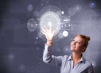 Attractive businesswoman touching abstract high technology circu