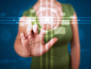 Woman pressing high tech type of modern buttons