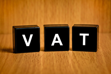 VAT or value added tax word on black block