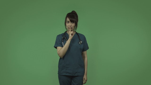 indian female doctor isolated on greenscreen with fingers on