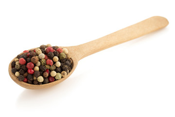 pepper in spoon  on white