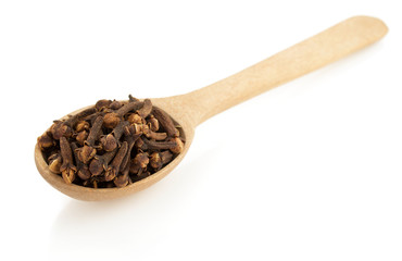 clove spices and spoon  on white