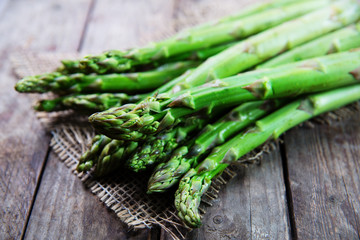 Bunch of fresh green asparagus on wooden rustic table