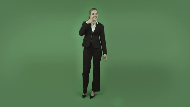 attractive caucasian business girl isolated on green with call