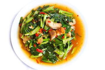 Fried kale with crispy pork, Thai food.