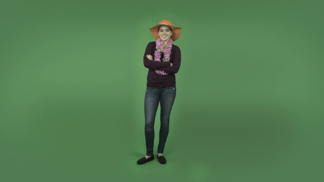 attractive casual caucasian girl isolated on green with straw