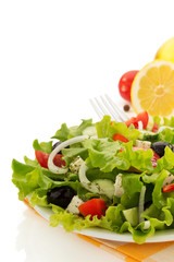 salad in plate on white