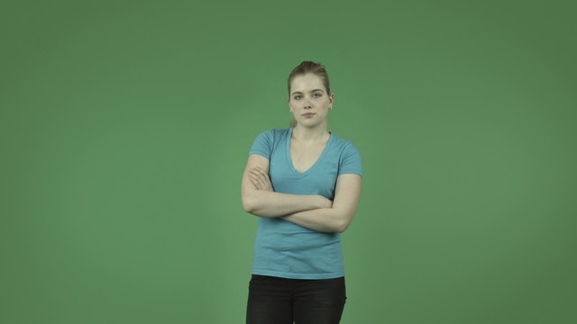 attractive upset caucasian casual girl isolated on green