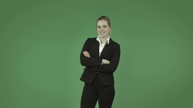 attractive caucasian business girl isolated on green confident