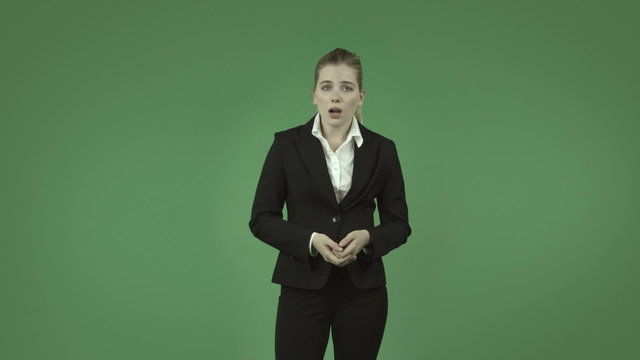 attractive caucasian business girl isolated on green upset