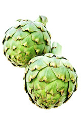 Fototapeta premium close up of a green fresh artichoke on a white background