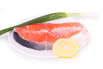 salmon with herbs on a white plate