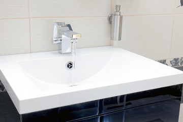 Chromium-plate tap with water.