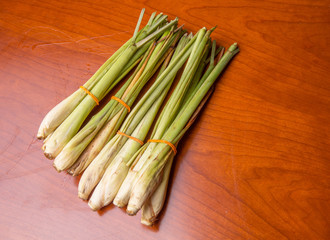 A bunch of lemongrass on wooden surface