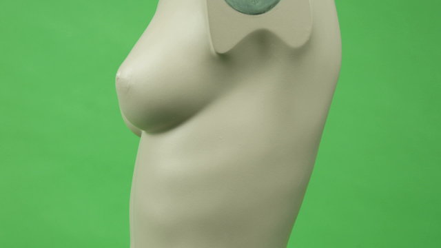 female torso isolated on chroma green screen background breast