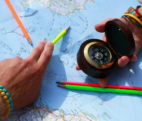 Route on the map with the help of a compass, travel