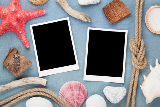 Travel photo frames on blue wooden texture