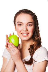 Photo of a young woman with green apple. Healthy eating concept.