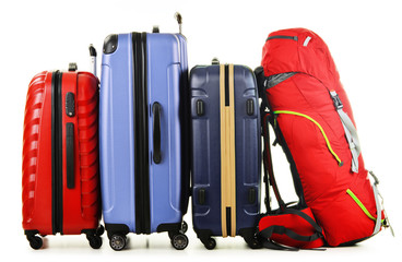 Suitcases and rucksack isolated on white