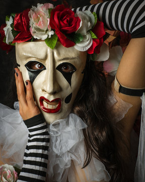 Closeup of Woman in a Jester Like Pierrot Mask
