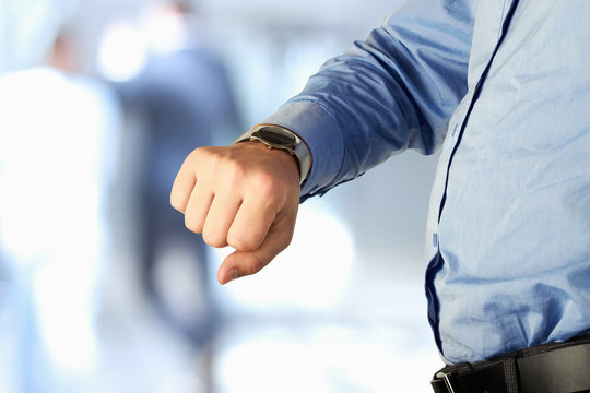 Businessman Checking Time On His Watch