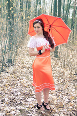 Obraz premium smiling girl holding a decorative umbrella