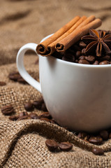 Coffee beans, aniseed and cinnamon in the coffee cup