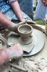 Fototapeta na wymiar Pottery - formation process of the clay dish with traditional me