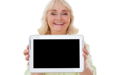 Copy space on her tablet.