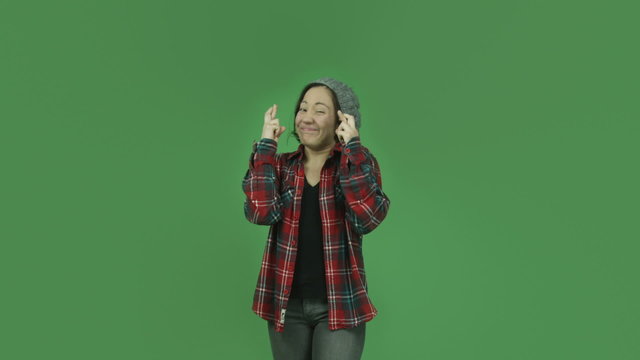 caucasian casual girl isolated on green screen with fingers